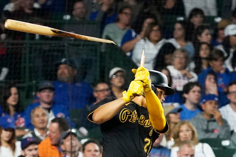 Sep 21, 2023; Chicago, Illinois, USA; Pittsburgh Pirates catcher Endy Rodriguez (25) breaks his bat as he grounds out against the Chicago Cubs during the fifth inning at Wrigley Field. Mandatory Credit: David Banks-USA TODAY Sports