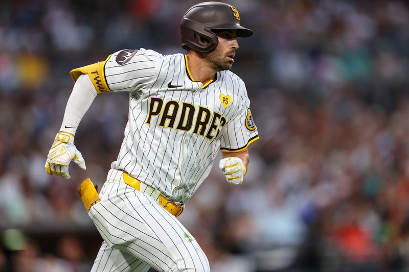 Sep 7, 2024; San Diego, California, USA; San Diego Padres third baseman Tyler Wade (14) doubles against the San Francisco Giants in the fifth inning at Petco Park. Mandatory Credit: Chadd Cady-Imagn Images