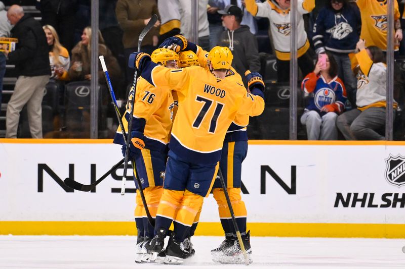 Jan 13, 2026; Nashville, Tennessee, USA;  Nashville Predators defenseman Roman Josi (59) celebrates the game winning goal with his teammates against the Edmonton Oilers during the overtime period at Bridgestone Arena. Mandatory Credit: Steve Roberts-Imagn Images
