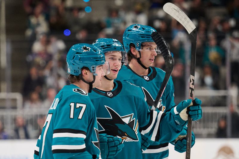 Apr 6, 2024; San Jose, California, USA; San Jose Sharks left wing William Eklund (72) celebrates with center Thomas Bordeleau (17) and defenseman Henry Thrun (3) after scoring a goal against the St. Louis Blues during the second period at SAP Center at San Jose. Mandatory Credit: Robert Edwards-USA TODAY Sports