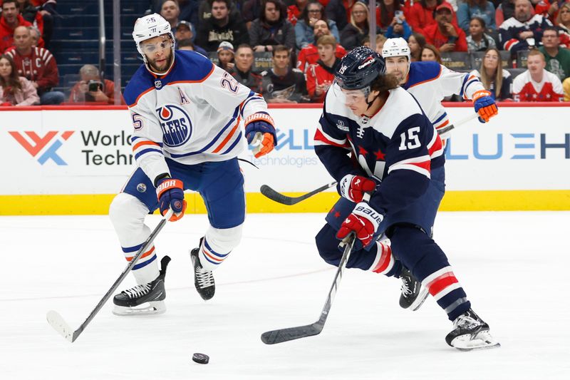 Nov 24, 2023; Washington, District of Columbia, USA; Washington Capitals left wing Sonny Milano (15) skates with the puck as Edmonton Oilers defenseman Darnell Nurse (25) defends in the first period at Capital One Arena. Mandatory Credit: Geoff Burke-USA TODAY Sports