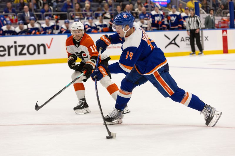 Nov 25, 2023; Elmont, New York, USA; New York Islanders center Bo Horvat (14) takes a shot against the Philadelphia Flyers during overtime at UBS Arena. Mandatory Credit: Thomas Salus-USA TODAY Sports