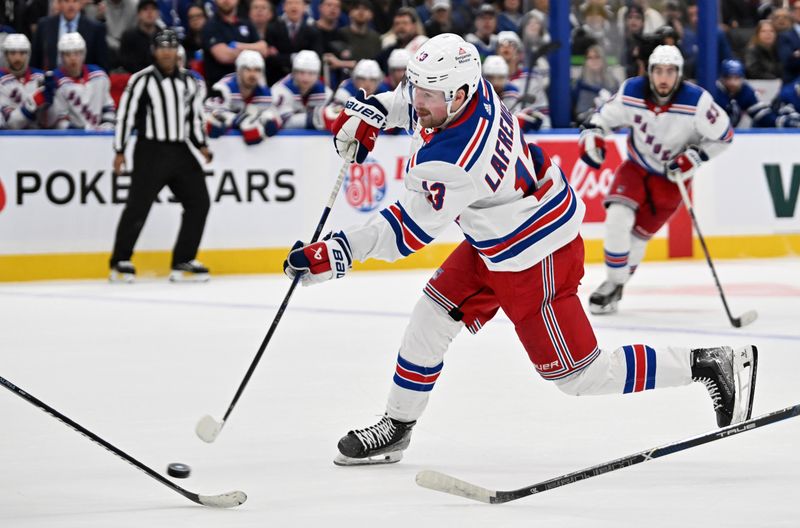 Mar 2, 2024; Toronto, Ontario, CAN;  New York Rangers forward Alexis Lafreniere (13) shoots the puck against the Toronto Maple Leafs in overtime at Scotiabank Arena. Mandatory Credit: Dan Hamilton-USA TODAY Sports