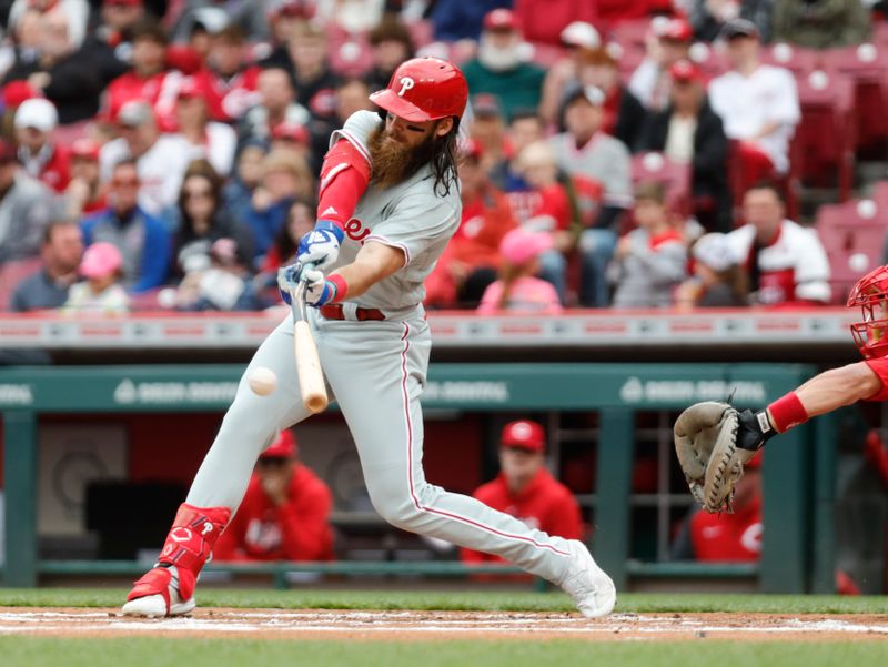 Apr 16, 2023; Cincinnati, Ohio, USA; Philadelphia Phillies center fielder Brandon Marsh hits a two-run single against the Cincinnati Reds during the first inning at Great American Ball Park. Mandatory Credit: David Kohl-USA TODAY Sports