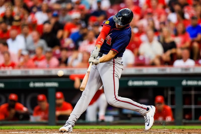 Sep 18, 2024; Cincinnati, Ohio, USA; Atlanta Braves first baseman Matt Olson (28) hits a RBI single in the fourth inning against the Cincinnati Reds at Great American Ball Park. Mandatory Credit: Katie Stratman-Imagn Images