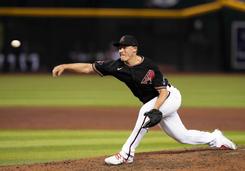 Sep 1, 2023; Phoenix, Arizona, USA; Arizona Diamondbacks relief pitcher Paul Sewald (38) pitches against the Baltimore Orioles during the ninth inning at Chase Field. Mandatory Credit: Joe Camporeale-USA TODAY Sports