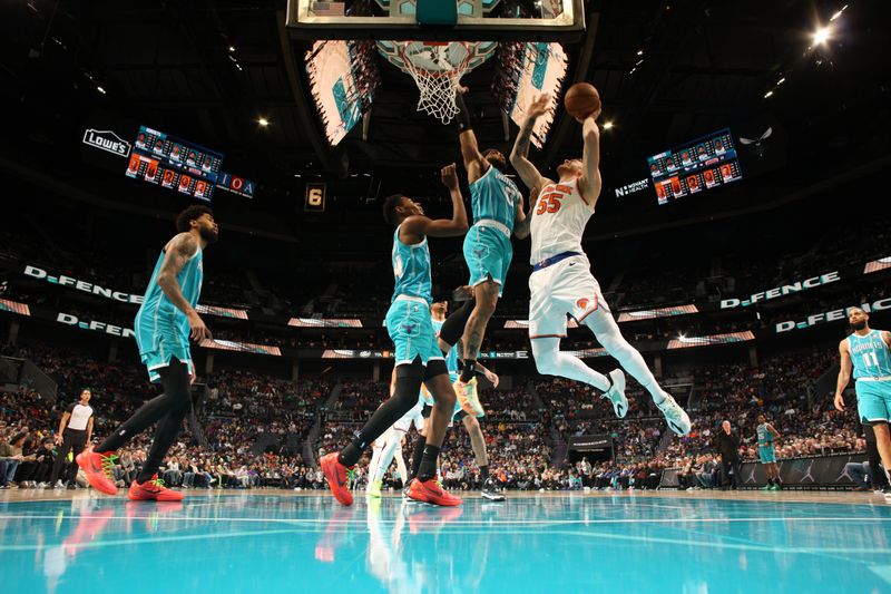 CHARLOTTE, NC - JANUARY 29: Isaiah Hartenstein #55 of the New York Knicks shoots the ball during the game against the Charlotte Hornets on January 29, 2024 at Spectrum Center in Charlotte, North Carolina. NOTE TO USER: User expressly acknowledges and agrees that, by downloading and or using this photograph, User is consenting to the terms and conditions of the Getty Images License Agreement. Mandatory Copyright Notice: Copyright 2024 NBAE (Photo by Kent Smith/NBAE via Getty Images)