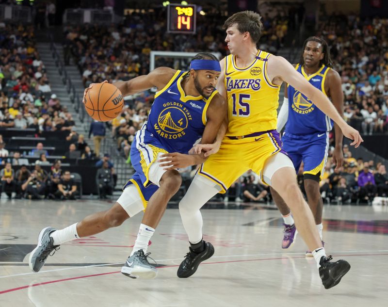 LAS VEGAS, NEVADA - OCTOBER 15: Moses Moody #4 of the Golden State Warriors drives against Austin Reaves #15 of the Los Angeles Lakers in the second quarter of their preseason game at T-Mobile Arena at T-Mobile Arena on October 15, 2024 in Las Vegas, Nevada. NOTE TO USER: User expressly acknowledges and agrees that, by downloading and or using this photograph, User is consenting to the terms and conditions of the Getty Images License Agreement. (Photo by Ethan Miller/Getty Images)