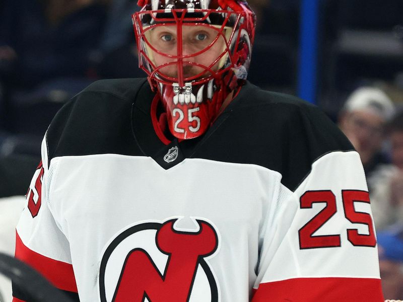 Nov 18, 2025; Tampa, Florida, USA; New Jersey Devils goaltender Jacob Markstrom (25) looks on against the Tampa Bay Lightning during the third period at Benchmark International Arena. Mandatory Credit: Kim Klement Neitzel-Imagn Images