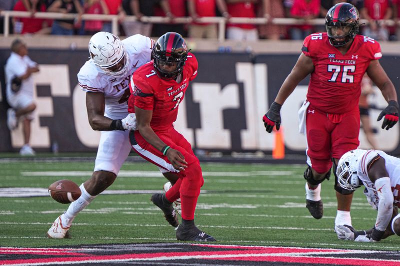 Sep 24, 2022; Lubbock, Texas, USA; Texas Tech Red Raiders quarterback Donovan Smith (7) turns to chase a fumble against the Texas Longhorns during a game at Jones AT&T Stadium. Mandatory Credit: Aaron E. Martinez/Austin American-Statesman via USA TODAY NETWORK