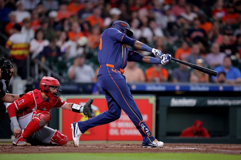 May 20, 2024; Houston, Texas, USA; Houston Astros designated hitter Yordan Alvarez (44) hits a single against the Los Angeles Angels during the first inning at Minute Maid Park. Mandatory Credit: Erik Williams-USA TODAY Sports