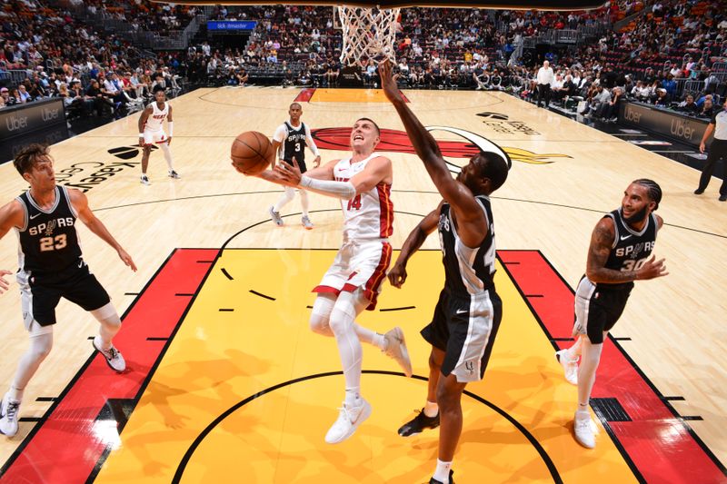 MIAMI, FL - OCTOBER 15: Tyler Herro #14 of the Miami Heat drives to the basket during the game against the San Antonio Spurs during a NBA preseason game on October 15, 2024 at Kaseya Center in Miami, Florida. NOTE TO USER: User expressly acknowledges and agrees that, by downloading and or using this Photograph, user is consenting to the terms and conditions of the Getty Images License Agreement. Mandatory Copyright Notice: Copyright 2024 NBAE (Photo by Jesse D. Garrabrant/NBAE via Getty Images)