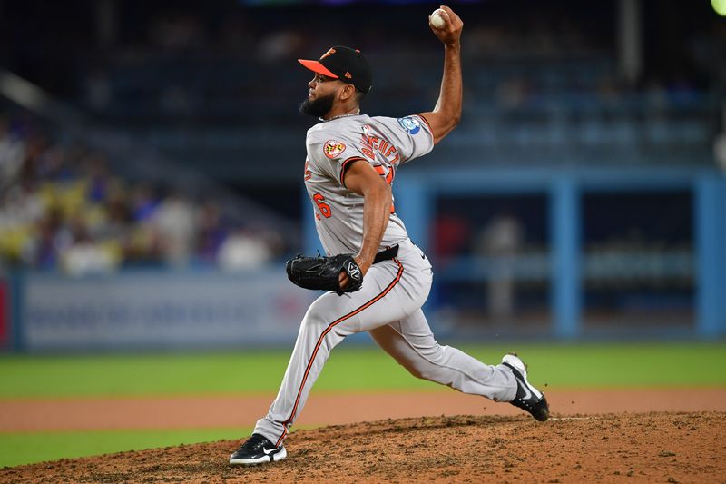 Aug 27, 2024; Los Angeles, California, USA; Baltimore Orioles pitcher Seranthony Domínguez (56) throws against the Los Angeles Dodgers during the ninth inning at Dodger Stadium. Mandatory Credit: Gary A. Vasquez-USA TODAY Sports