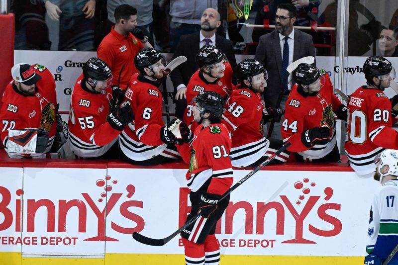 Mar 6, 2026; Chicago, Illinois, USA;  Chicago Blackhawks center Frank Nazar (91) (front) celebrates his goal against the Vancouver Canucks with teammates during the second  period at United Center. Mandatory Credit: Matt Marton-Imagn Images