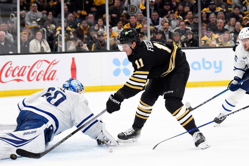 Apr 30, 2024; Boston, Massachusetts, USA; Toronto Maple Leafs goaltender Joseph Woll (60) makes a pad save on Boston Bruins center Trent Frederic (11) during the third period in game five of the first round of the 2024 Stanley Cup Playoffs at TD Garden. Mandatory Credit: Bob DeChiara-USA TODAY Sports