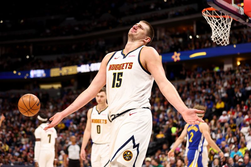 DENVER, COLORADO - DECEMBER 25: Nikola Jokic #15 of the Denver Nuggets reacts to a call against the Golden State Warriors at Ball Arena on December 25, 2023 in Denver, Colorado. NOTE TO USER: User expressly acknowledges and agrees that, by downloading and/or using this Photograph, user is consenting to the terms and conditions of the Getty Images License Agreement. (Photo by Jamie Schwaberow/Getty Images)