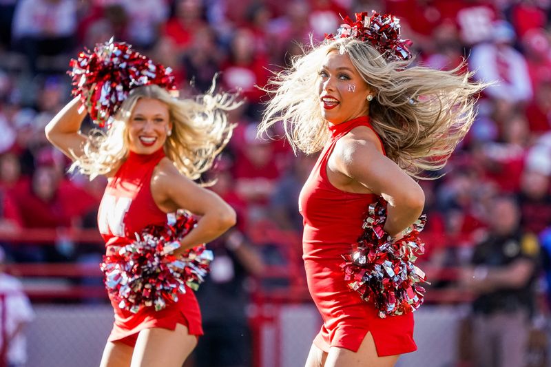 Oct 21, 2023; Lincoln, Nebraska, USA; Nebraska Cornhuskers cheerleaders perform during a break in the third quarter against the Northwestern Wildcats at Memorial Stadium. Mandatory Credit: Dylan Widger-USA TODAY Sports