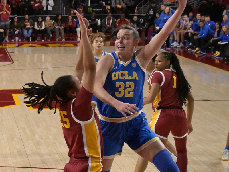Jan 14, 2024; Los Angeles, California, USA; UCLA Bruins forward Angela Dugalic (32) shoots over USC Trojans guard McKenzie Forbes (25) in the first half at Galen Center. Mandatory Credit: Jayne Kamin-Oncea-USA TODAY Sports