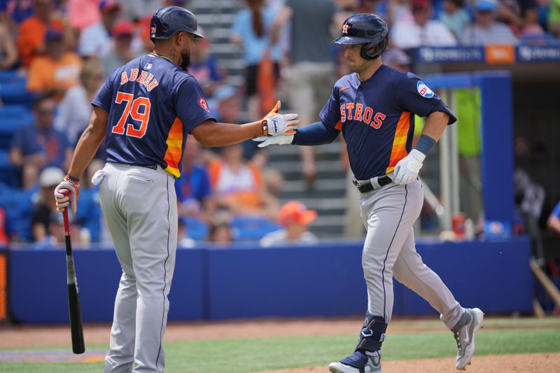 Mar 23, 2024; Port St. Lucie, Florida, USA;  Houston Astros third baseman Alex Bregman (2) is congratulated by Houston Astros first baseman Jose Abreu (79) on his second three-run home run of the game against the New York Mets in the fifth inning at Clover Park. Mandatory Credit: Jim Rassol-USA TODAY Sports