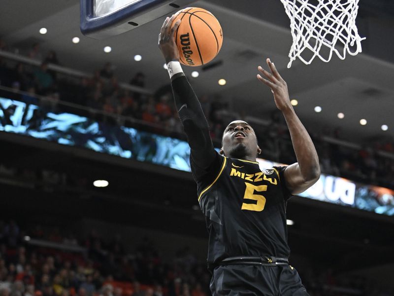 Feb 14, 2023; Auburn, Alabama, USA; Missouri Tigers guard D'Moi Hodge (5) scores against the Auburn Tigers during the first half at Neville Arena. Mandatory Credit: Julie Bennett-USA TODAY Sports