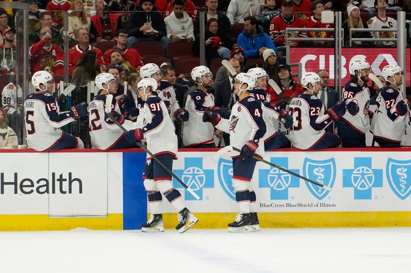 Dec 1, 2024; Chicago, Illinois, USA; Columbus Blue Jackets center Kent Johnson (91) celebrates his goal against the Chicago Blackhawks during the first period at United Center. Mandatory Credit: David Banks-Imagn Images