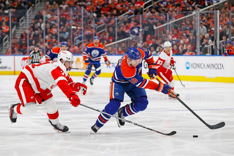 Feb 13, 2024; Edmonton, Alberta, CAN; Edmonton Oilers forward Zach Hyman (18) carries the puck past Detroit Red Wings forward Dylan Larkin (71) during the third period at Rogers Place. Mandatory Credit: Perry Nelson-USA TODAY Sports