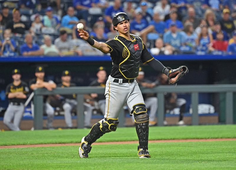 Aug 28, 2023; Kansas City, Missouri, USA;  Pittsburgh Pirates catcher Endy Rodriguez (25) throws the ball to first base for an out in the fourth inning against the Kansas City Royals at Kauffman Stadium. Mandatory Credit: Peter Aiken-USA TODAY Sports