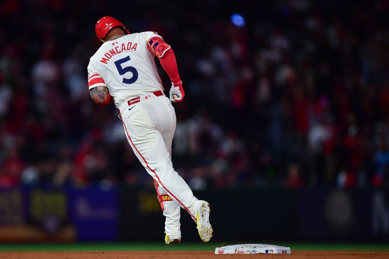 May 27, 2025; Anaheim, California, USA; Los Angeles Angels third baseman Yoan Moncada (5) runs the bases after hitting a solo home run against the New York Yankees during the ninth inning at Angel Stadium. Mandatory Credit: Gary A. Vasquez-Imagn Images