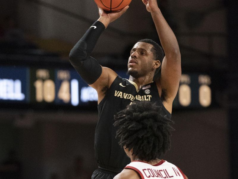 Jan 14, 2023; Nashville, Tennessee, USA;   
Vanderbilt Commodores guard Jordan Wright (4) shoots the ball over Arkansas Razorbacks guard Ricky Council IV (1) during the second half at Memorial Gymnasium. Mandatory Credit: George Walker IV - USA TODAY Sports