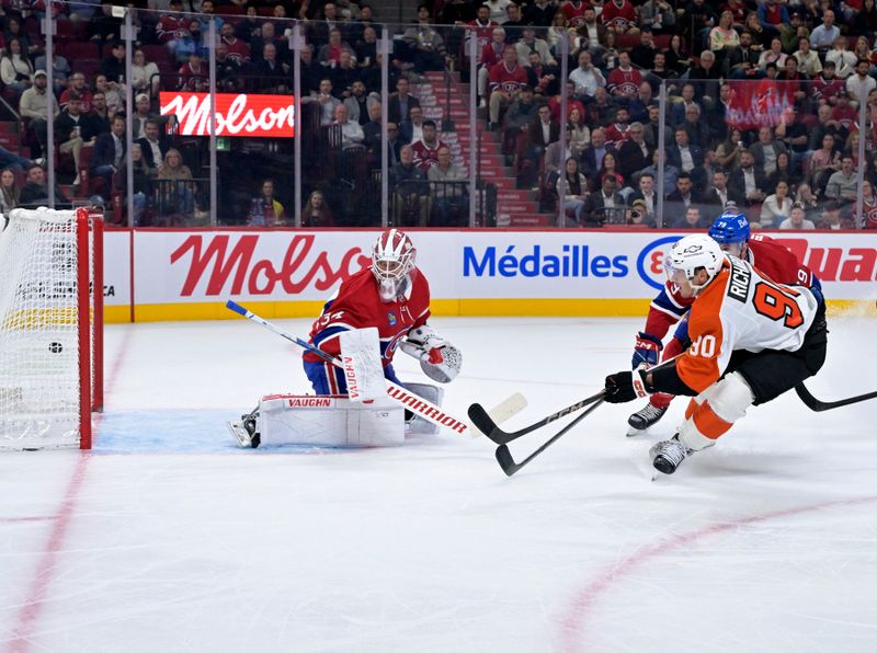 Sep 23, 2025; Montreal, Quebec, CAN; Philadelphia Flyers forward Anthony Richard (90) scores a goal against Montreal Canadiens goalie Kaapo Kahkonen (34) during the second period at the Bell Centre. Mandatory Credit: Eric Bolte-Imagn Images