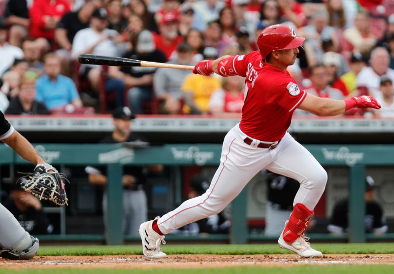 May 6, 2023; Cincinnati, Ohio, USA; Cincinnati Reds third baseman Spencer Steer (7) hits an RBI single against the Chicago White Sox during the first inning at Great American Ball Park. Mandatory Credit: David Kohl-USA TODAY Sports