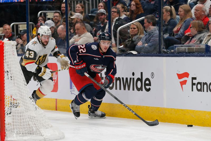 Mar 4, 2024; Columbus, Ohio, USA; Columbus Blue Jackets defenseman Jake Bean (22) goes after a loose puck as Vegas Golden Knights center Paul Cotter (43) trails the play during the first period at Nationwide Arena. Mandatory Credit: Russell LaBounty-USA TODAY Sports