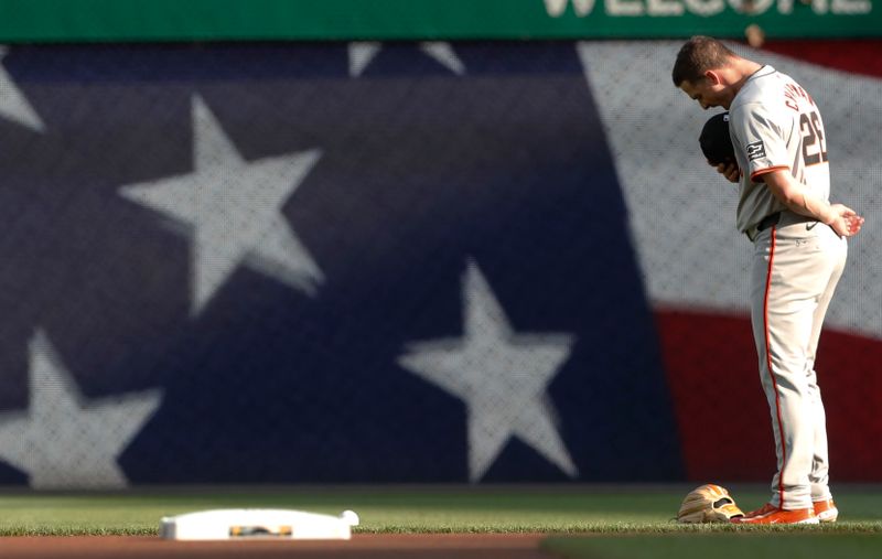 May 21, 2024; Pittsburgh, Pennsylvania, USA;  San Francisco Giants third baseman Matt Chapman (26) stands for the national anthem against the Pittsburgh Pirates at PNC Park. Mandatory Credit: Charles LeClaire-USA TODAY Sports