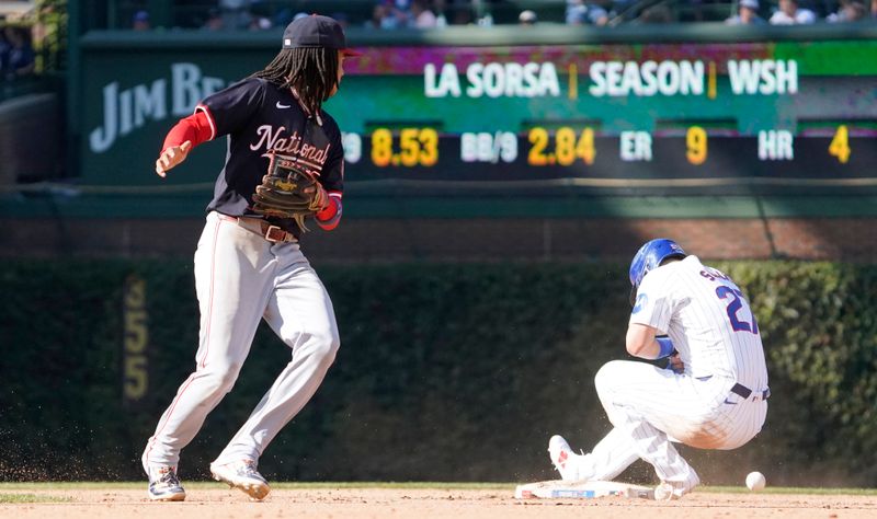 Sep 20, 2024; Chicago, Illinois, USA; Chicago Cubs outfielder Seiya Suzuki (27) steals second base as Washington Nationals shortstop CJ Abrams (5) takes the throw during the eighth inning at Wrigley Field. Mandatory Credit: David Banks-Imagn Images