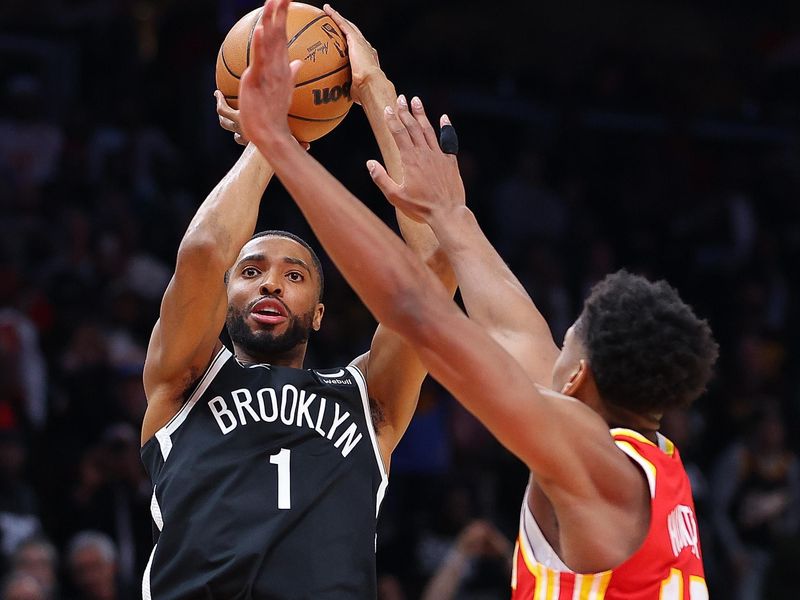 ATLANTA, GEORGIA - DECEMBER 06:  Mikal Bridges #1 of the Brooklyn Nets hits what ends up being the game-winning basket against De'Andre Hunter #12 of the Atlanta Hawks in the final seconds of their 114-113 at State Farm Arena on December 06, 2023 in Atlanta, Georgia.  NOTE TO USER: User expressly acknowledges and agrees that, by downloading and/or using this photograph, user is consenting to the terms and conditions of the Getty Images License Agreement.  (Photo by Kevin C. Cox/Getty Images)