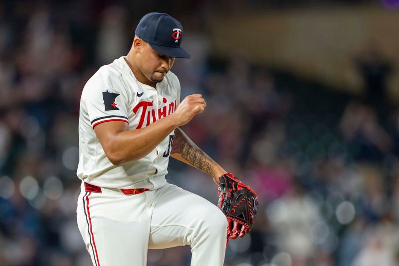 May 8, 2024; Minneapolis, Minnesota, USA; Minnesota Twins pitcher Jhoan Duran (59) celebrates after defeating the Seattle Mariners at Target Field. Mandatory Credit: Jesse Johnson-USA TODAY Sports