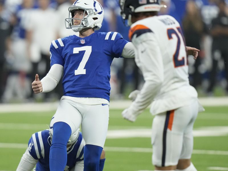 Indianapolis Colts kicker Matt Gay (7) kicks a field goal as punter Rigoberto Sanchez (8) holds during the first quarter of a preseason NFL football game against the Denver Broncos, Sunday, Aug. 11, 2024, in Westfield, Ind. (AP Photo/AJ Mast)