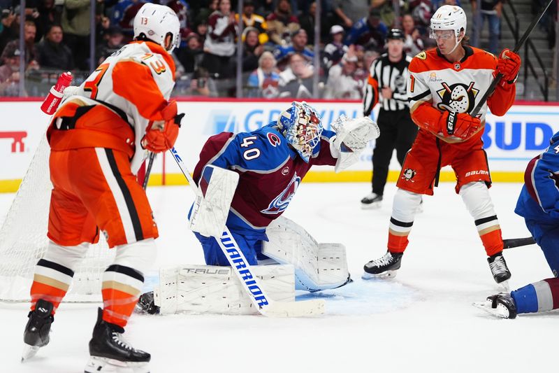 Oct 18, 2024; Denver, Colorado, USA; Colorado Avalanche goaltender Alexandar Georgiev (40) defends the net in front of Anaheim Ducks center Trevor Zegras (11) in third period Ball Arena. Mandatory Credit: Ron Chenoy-Imagn Images