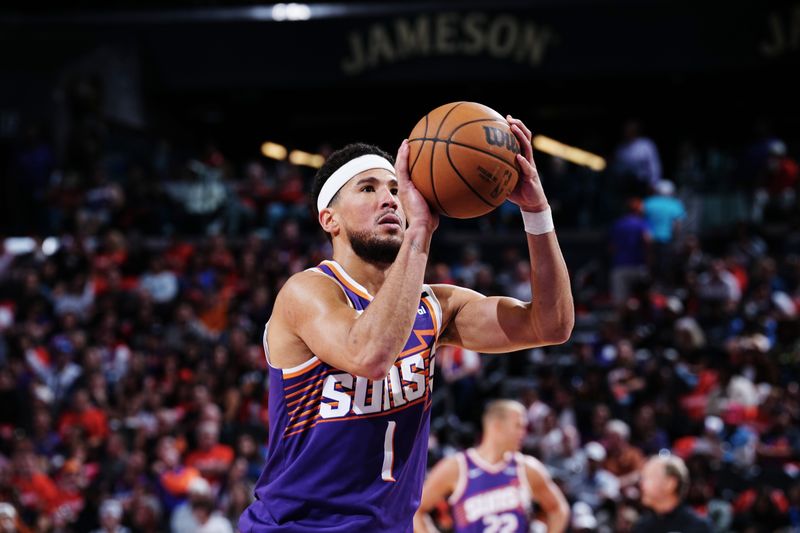 PHOENIX, AZ - OCTOBER  26: Devin Booker #1 of the Phoenix Suns shoots a free throw during the game against the Dallas Mavericks on October 26, 2024 at Footprint Center in Phoenix, Arizona. NOTE TO USER: User expressly acknowledges and agrees that, by downloading and or using this photograph, user is consenting to the terms and conditions of the Getty Images License Agreement. Mandatory Copyright Notice: Copyright 2024 NBAE (Photo by Kate Frese/NBAE via Getty Images)