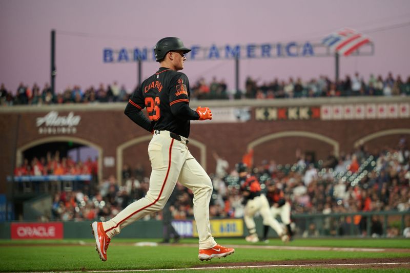 Aug 31, 2024; San Francisco, California, USA; San Francisco Giants infielder Matt Chapman (26) scores a run on an RBI single by infielder Tyler Fitzgerald (49) (not pictured) against the Miami Marlins during the sixth inning at Oracle Park. Mandatory Credit: Robert Edwards-USA TODAY Sports