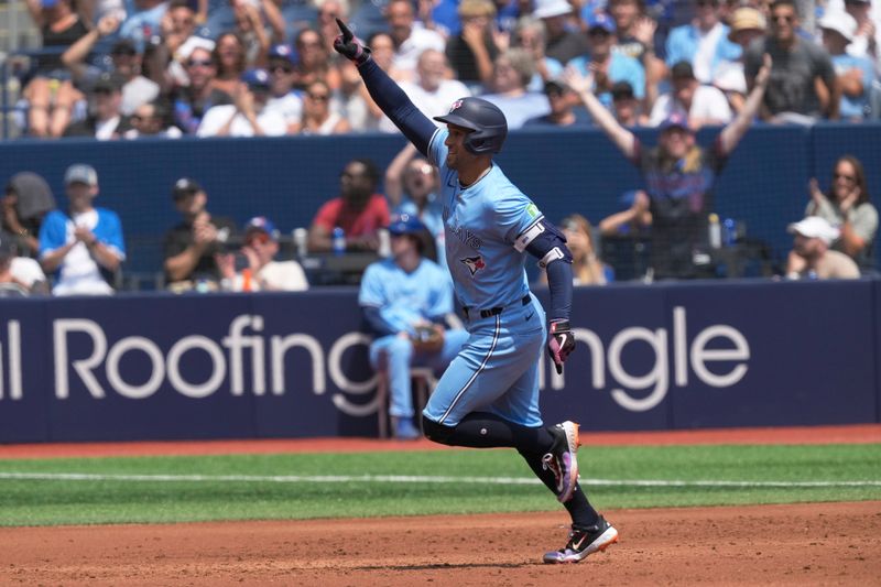 Jul 21, 2024; Toronto, Ontario, CAN; Toronto Blue Jays right fielder George Springer (4) celebrates his second solo home run of the game against the Detroit Tigers as he runs the bases during the third inning at Rogers Centre. Mandatory Credit: John E. Sokolowski-USA TODAY Sports