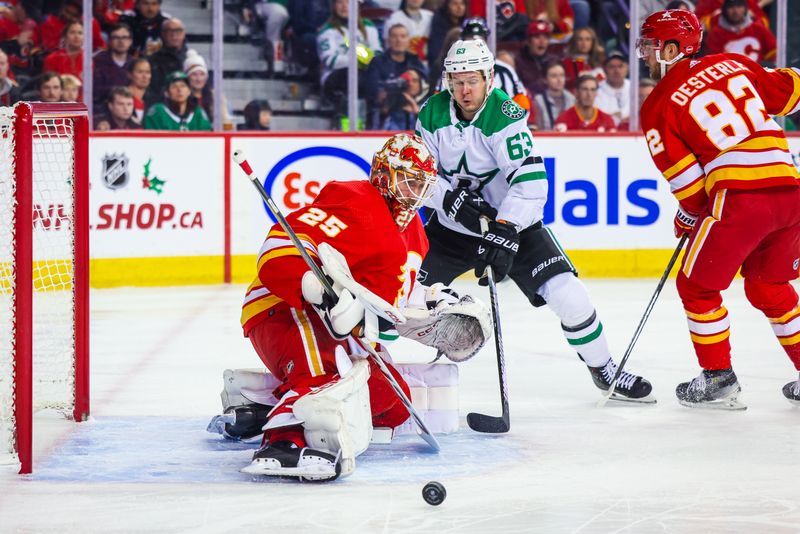 Nov 30, 2023; Calgary, Alberta, CAN; Calgary Flames goaltender Jacob Markstrom (25) makes a save against Dallas Stars right wing Evgenii Dadonov (63) during the first period at Scotiabank Saddledome. Mandatory Credit: Sergei Belski-USA TODAY Sports