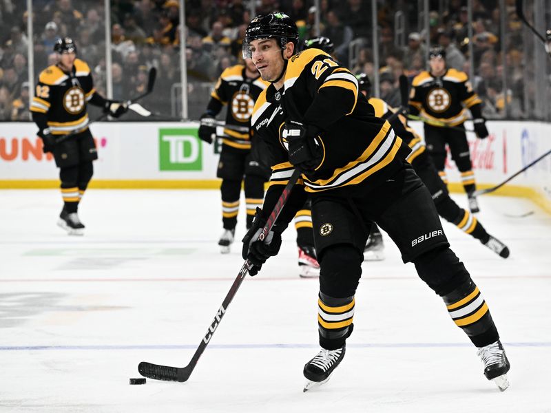 Mar 9, 2023; Boston, Massachusetts, USA; Boston Bruins right wing Garnet Hathaway (21) passes the puck during the first period of a game against the Edmonton Oilers at the TD Garden. Mandatory Credit: Brian Fluharty-USA TODAY Sports