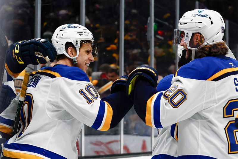 Nov 16, 2024; Boston, Massachusetts, USA; St. Louis Blues center Brayden Schenn (10) is congratulated by left wing Brandon Saad (20) after his goal in overtime defeated the Boston Bruins 3-2 at TD Garden. Mandatory Credit: Winslow Townson-Imagn Images