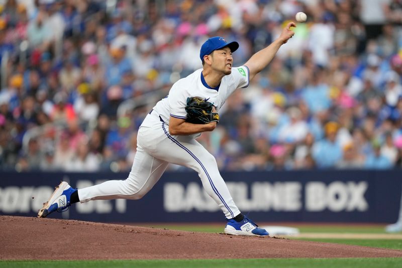 Jul 26, 2024; Toronto, Ontario, CAN; Toronto Blue Jays starting pitcher Yusei Kikuchi (16) pitches to the Texas Rangers during the first inning at Rogers Centre. Mandatory Credit: John E. Sokolowski-USA TODAY Sports