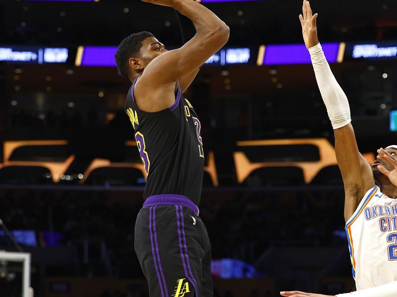 LOS ANGELES, CALIFORNIA - JANUARY 15:  Rui Hachimura #28 of the Los Angeles Lakers takes a shot against Shai Gilgeous-Alexander #2 of the Oklahoma City Thunder in the first half at Crypto.com Arena on January 15, 2024 in Los Angeles, California.  NOTE TO USER: User expressly acknowledges and agrees that, by downloading and/or using this photograph, user is consenting to the terms and conditions of the Getty Images License Agreement.  (Photo by Ronald Martinez/Getty Images)