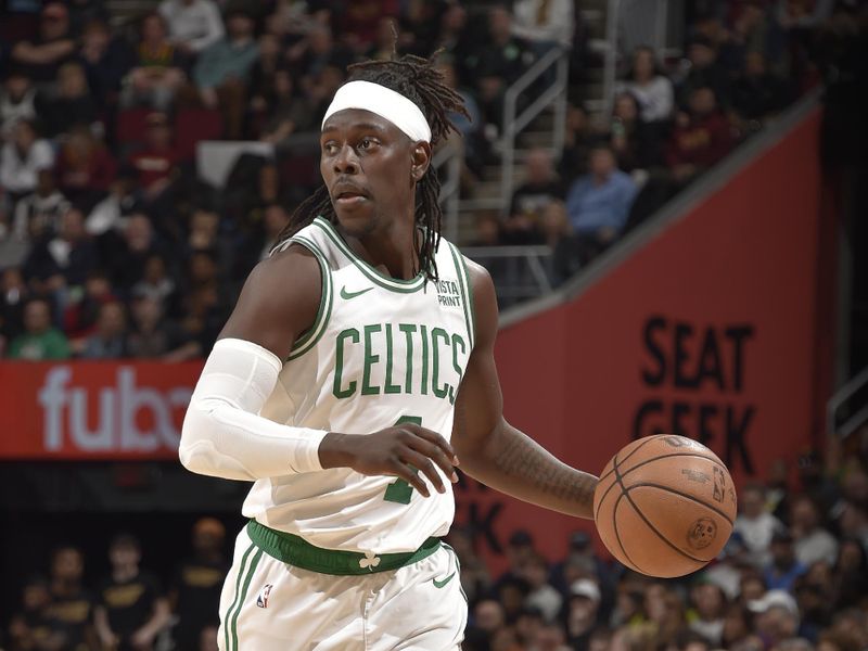 CLEVELAND, OH - MARCH 5: Jrue Holiday #4 of the Boston Celtics dribbles the ball during the game against the Cleveland Cavaliers on March 5, 2024 at Rocket Mortgage FieldHouse in Cleveland, Ohio. NOTE TO USER: User expressly acknowledges and agrees that, by downloading and/or using this Photograph, user is consenting to the terms and conditions of the Getty Images License Agreement. Mandatory Copyright Notice: Copyright 2024 NBAE (Photo by David Liam Kyle/NBAE via Getty Images)