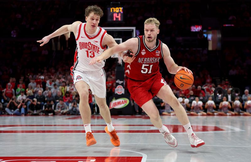 Jan 5, 2026; Columbus, Ohio, USA;  Nebraska Cornhuskers forward Rienk Mast (51) goes to the basket as Ohio State Buckeyes center Christoph Tilly (13) defends during the first half at Value City Arena. Mandatory Credit: Joseph Maiorana-Imagn Images