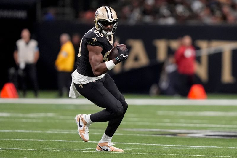 New Orleans Saints tight end Juwan Johnson (83) runs with the ball during the second half of an NFL football game against the Carolina Panthers, Sunday, Sept. 8, 2024, in New Orleans. (AP Photo/Gerald Herbert)