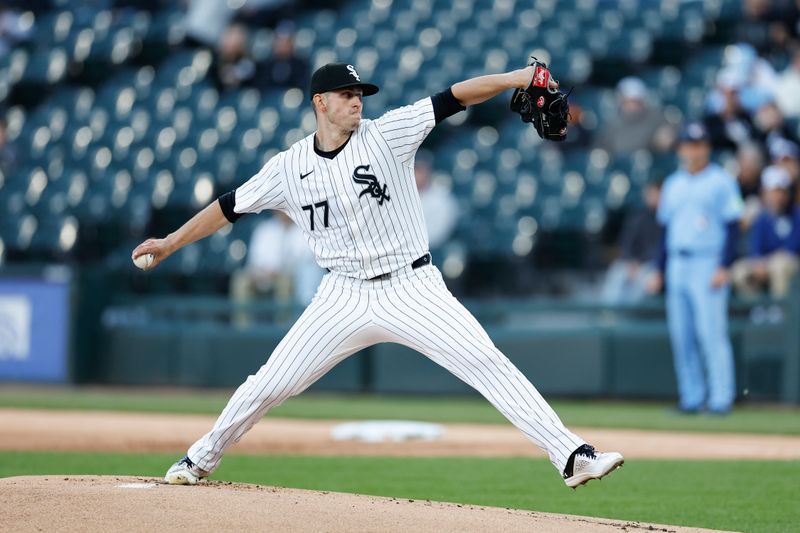 May 27, 2024; Chicago, Illinois, USA; Chicago White Sox starting pitcher Chris Flexen (77) delivers a pitch against the Toronto Blue Jays during the first inning at Guaranteed Rate Field. Mandatory Credit: Kamil Krzaczynski-USA TODAY Sports